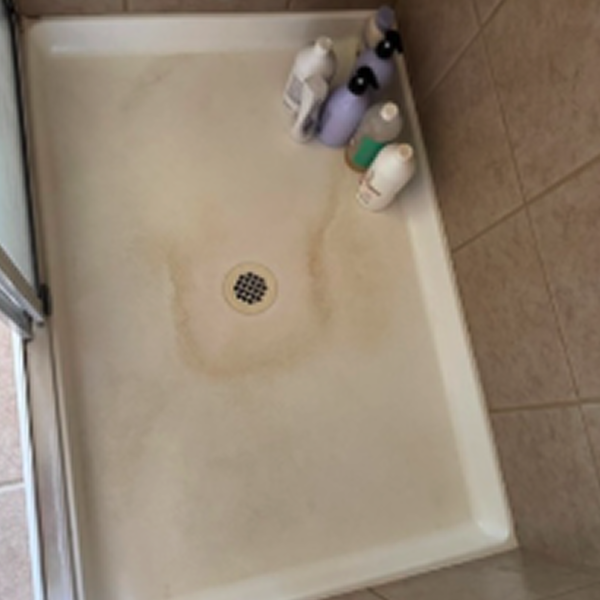 Spotless glass shower after Scrub Club's shower and tub treatment