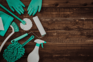 home cleaning tools and supplies on table